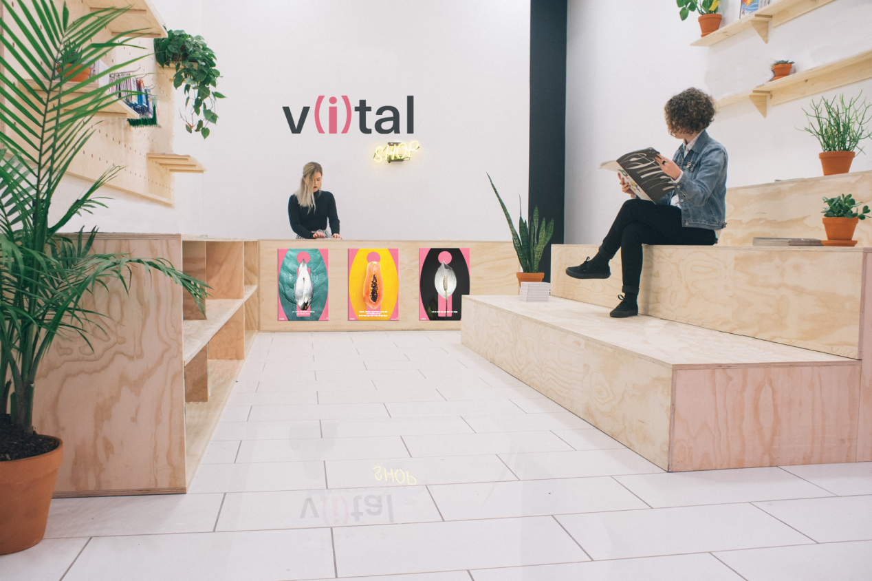 V(i)tal pop-up shop interior with plywood shelving and campaign posters
